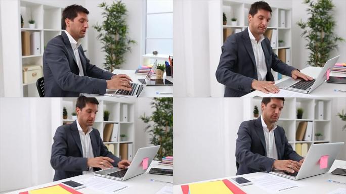 在笔记本电脑上工作的商人