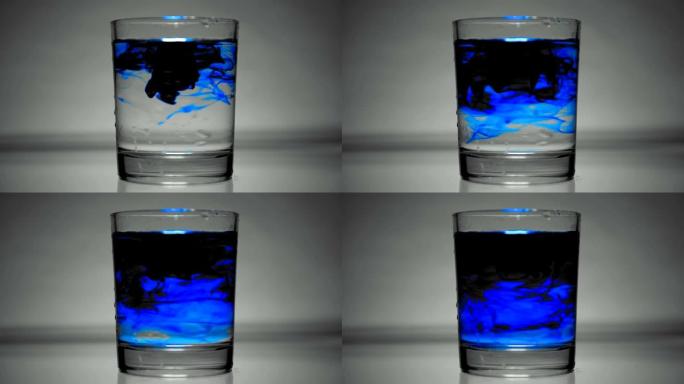 蓝色着色剂溶解在一杯水中