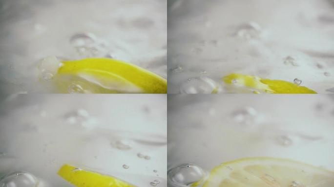 柠檬用喷雾剂滴入水中。慢mo
