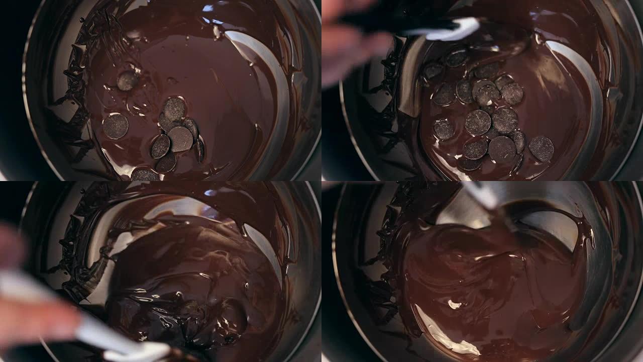 厨师面包师在碗中混合甜美美味的有机融化巧克力