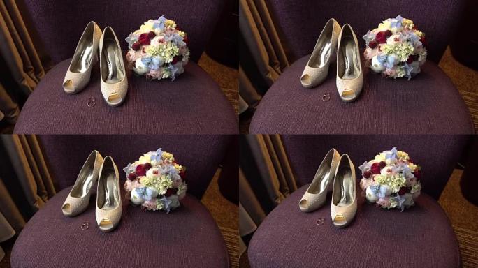 结婚戒指、花束和新娘鞋子