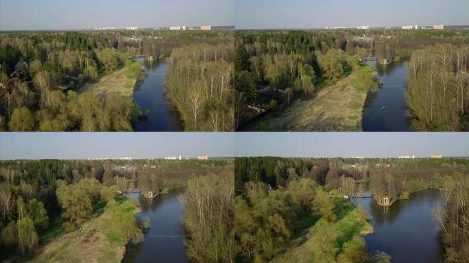 德斯纳河、树、船的鸟瞰图。新莫斯科。摄像机在河上水平缓慢向前移动。春天的时候。晴朗的天气