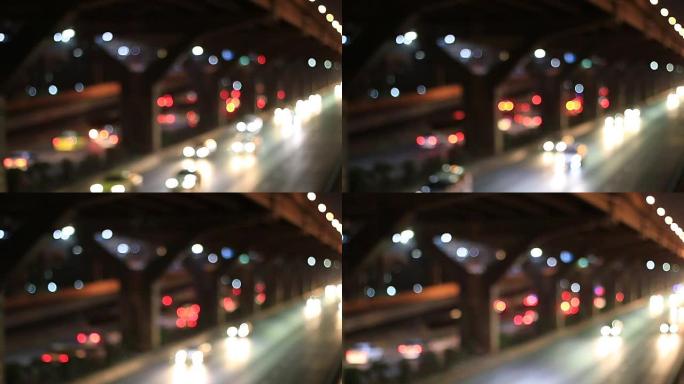 下雨后的午夜时分，街道上的灯光模糊的背景，光线背景的抽象粒子，从我的窗户出来。