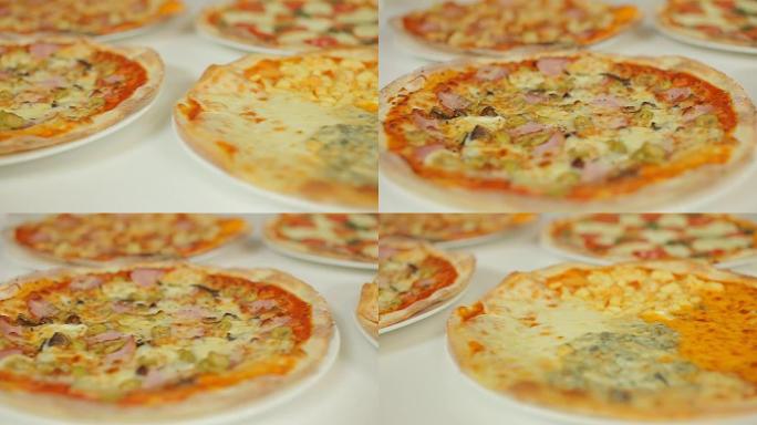 意大利披萨的展示。各种口味的什锦披萨。玛格丽特，反复无常，四种奶酪，四季。滑块多莉凸轮