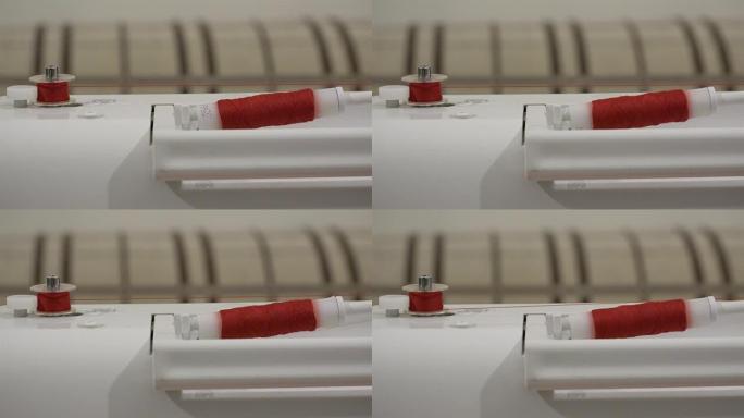 缝纫机上的红线轴快速梭芯缝制服装