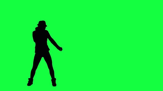一个戴着帽子的女孩的剪影像流行音乐之王一样跳舞。色度键背景