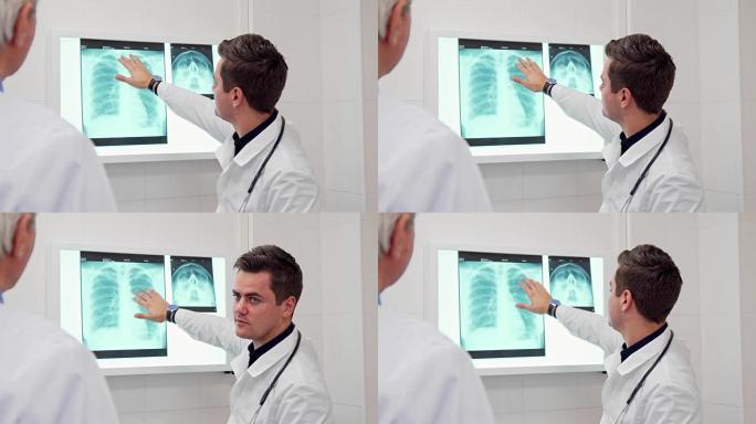 男医生给他的同事看了一些x光照片