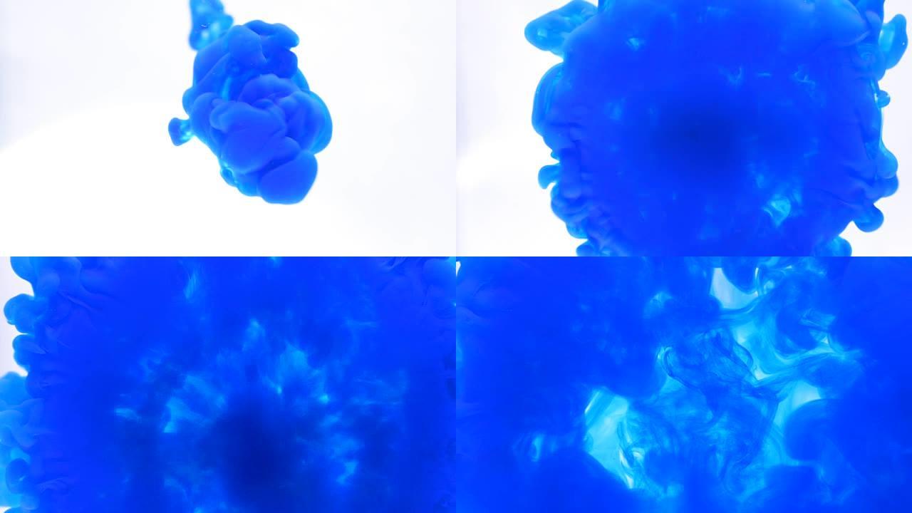 蓝色墨水流迅速流入水中，形成圆形和烟熏形状抽象背景
