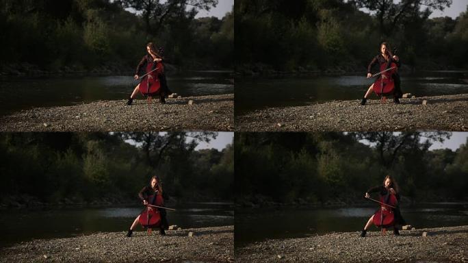 可爱的女孩正在河边演奏大提琴