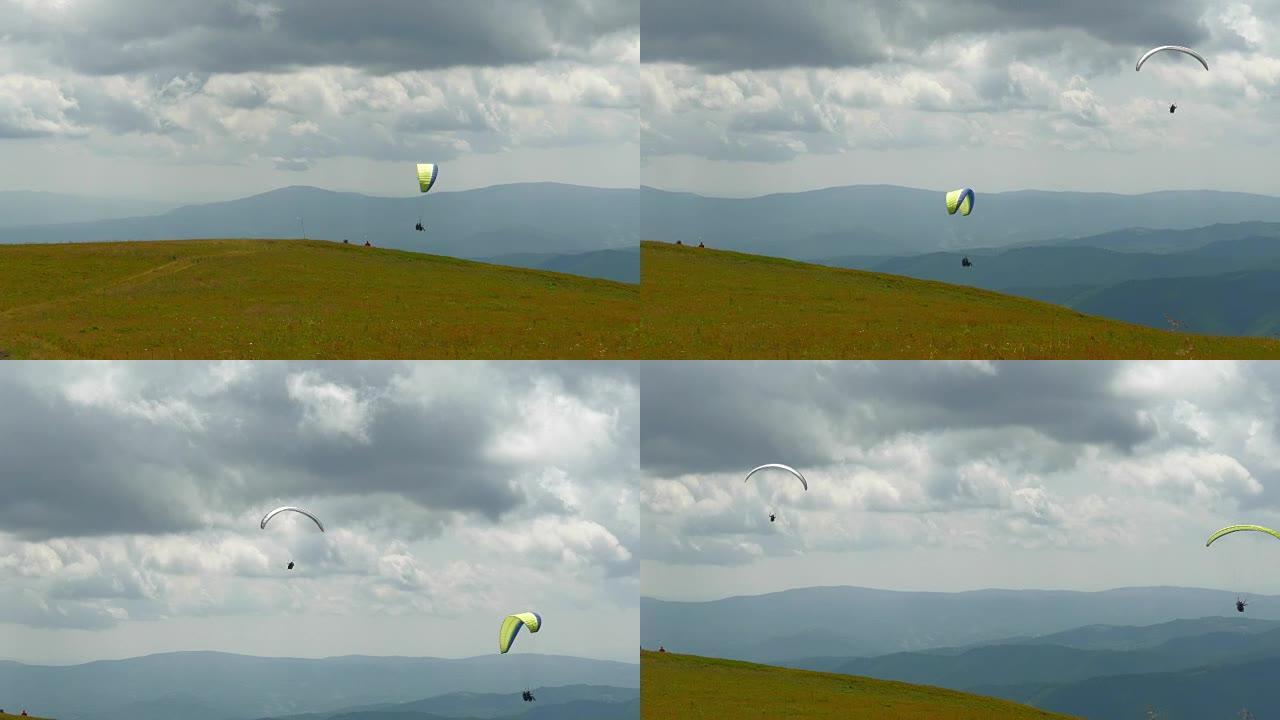 滑翔伞在山上高高飞翔