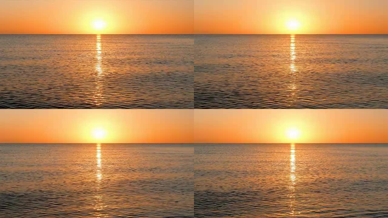 太阳升起在平静的海面上