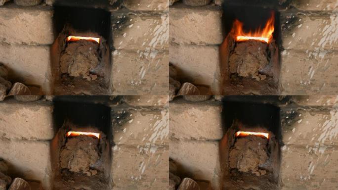 4k特写镜头，火焰和烟雾从瓷窑砖中冒出来。