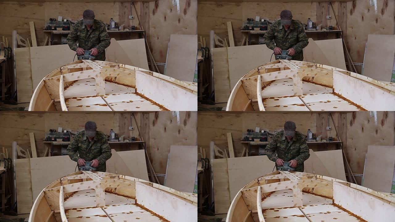 木匠在造船厂打磨细节木船