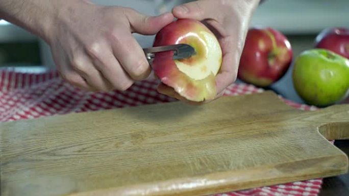 剥苹果。手切苹果皮。健康食品。素食
