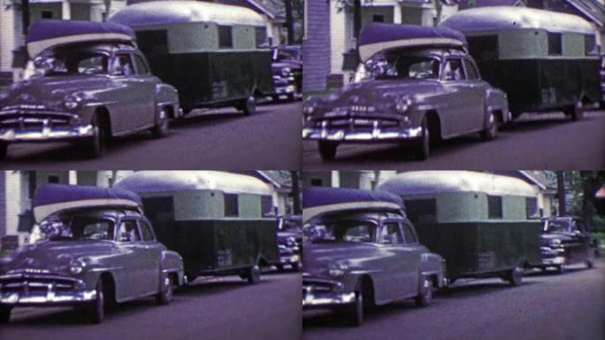 1953: 家庭卡车司机汽车装载独木舟和野营拖车度假。