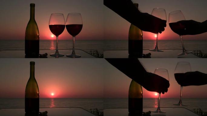 男人和女人在日落时用红酒碰杯