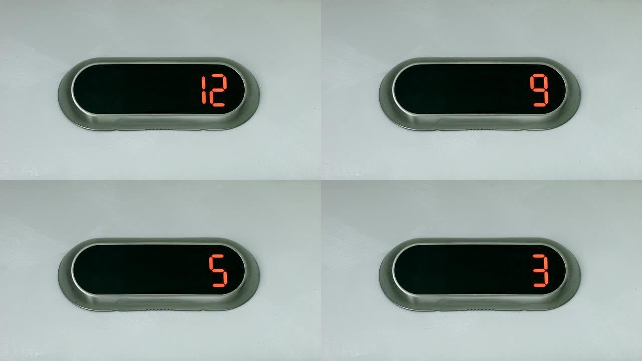 显示楼层编号的数字显示器。电梯下到一楼