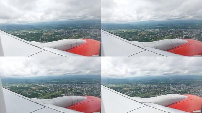 透过飞机窗户的云雾天空和山景，在泰国清莱上空飞行
