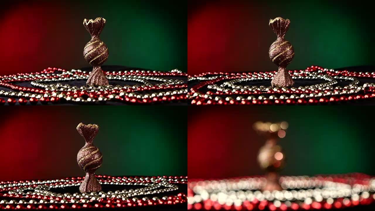 圣诞节或新年不寻常的糖果玩具和珠子，旋转，红色和绿色
