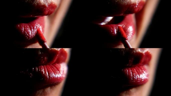 女人用口红画嘴唇，特写