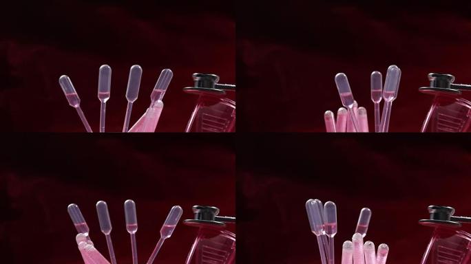 玻璃管测试实验室中的红色液体，滴管，模糊听诊器和护目镜，在设备机器上旋转的管