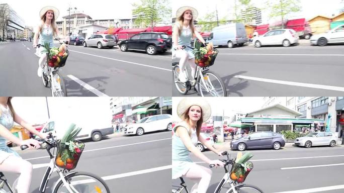 漂亮的金发女人在街上骑自行车