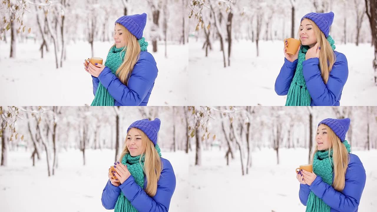 女孩冬天在户外喝咖啡。