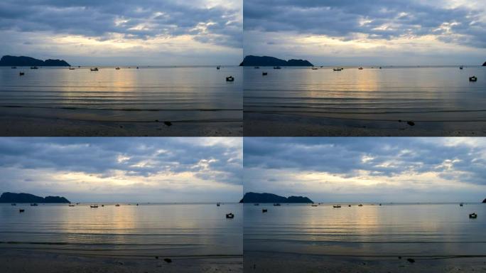 早晨阳光照射下的海上剪影渔船的风景景观
