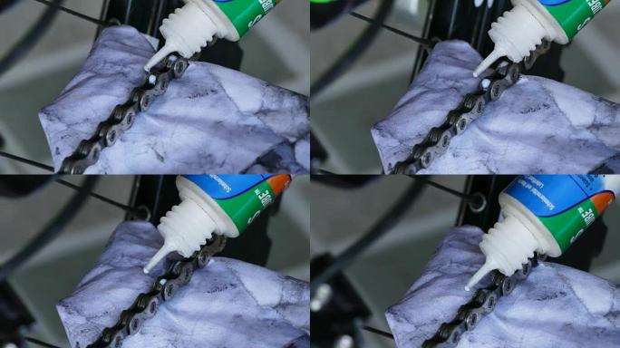 专业机械师在自行车上设置带油润滑的链条