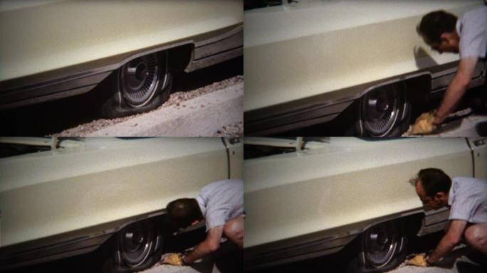 1971: 男子在烈日下在白色轿车上修理爆胎。