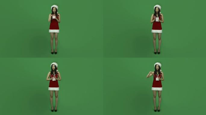 亚洲女孩性感圣诞老人孤立绿屏绿色背景不安