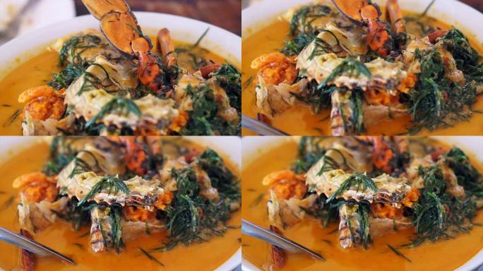 泰国菜，海鲜蓝蟹配辣椰子咖喱汤和蔬菜