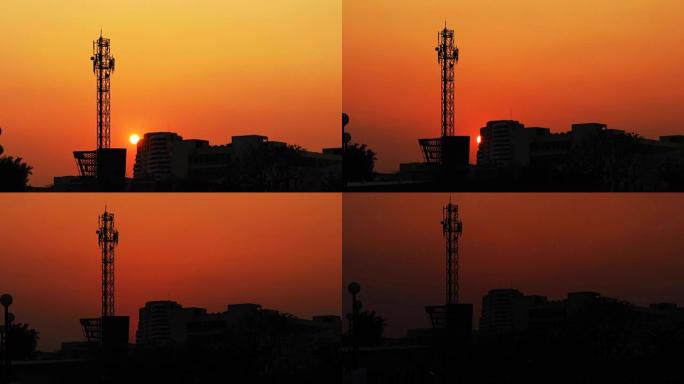 背景中的塔楼之城的日落