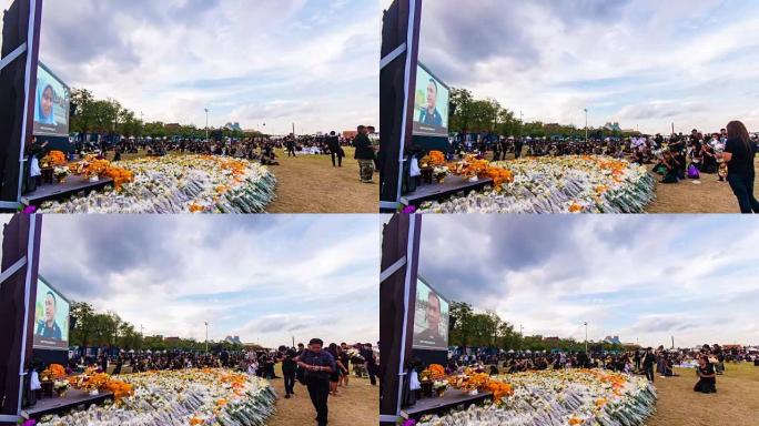 泰国曼谷城堡前，许多穿着黑色连衣裙的人在公园里为国王之死哀悼。