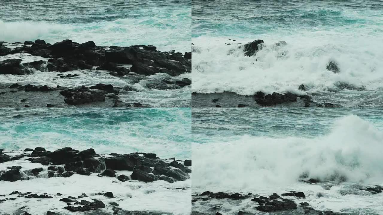 强大的海浪在沿海岩石上破裂