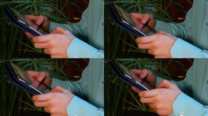 商人使用平板电脑的手