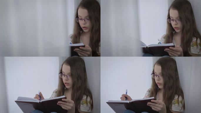 戴眼镜的美丽小女孩口述自己，并在日记中写道