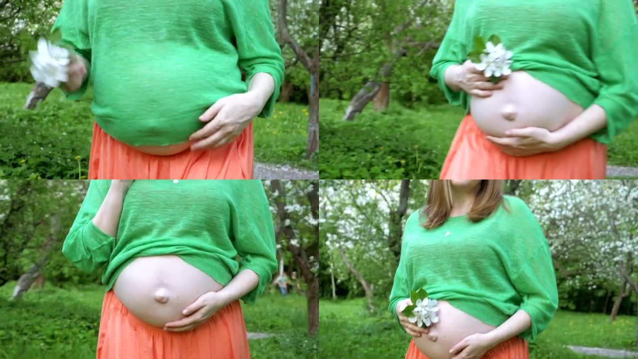 孕妇在户外抚平腹部