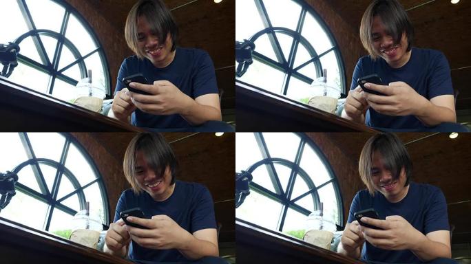 男子在咖啡店使用手机