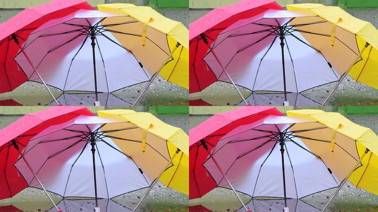 用雨滴打开五颜六色的雨伞