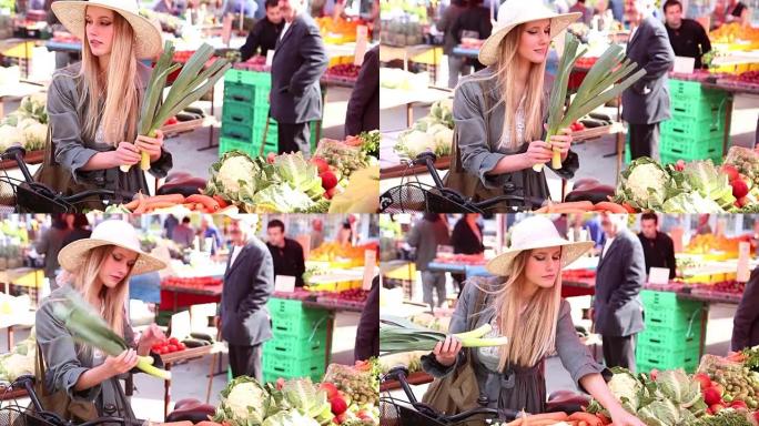 在市场上摘韭菜的漂亮女孩