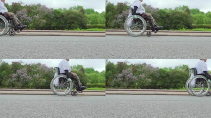 意志力和强手的概念。残疾人运动员在比赛中坐在运动轮椅上。慢动作。循环