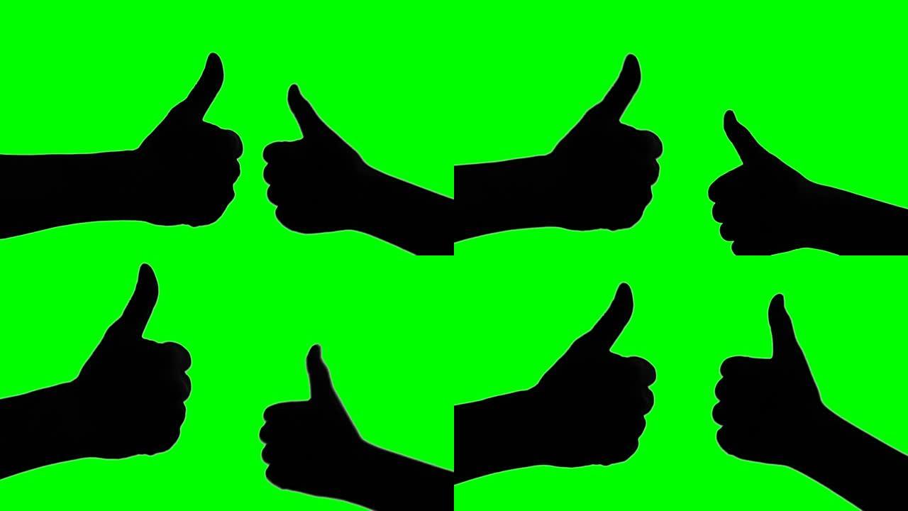 绿色屏幕背景上双手竖起大拇指的剪影