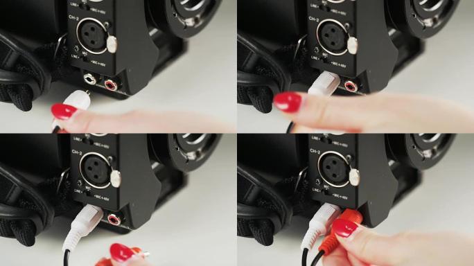 女人将红色和白色电缆插入相机