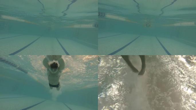 男子在游泳池蝴蝶水中游泳