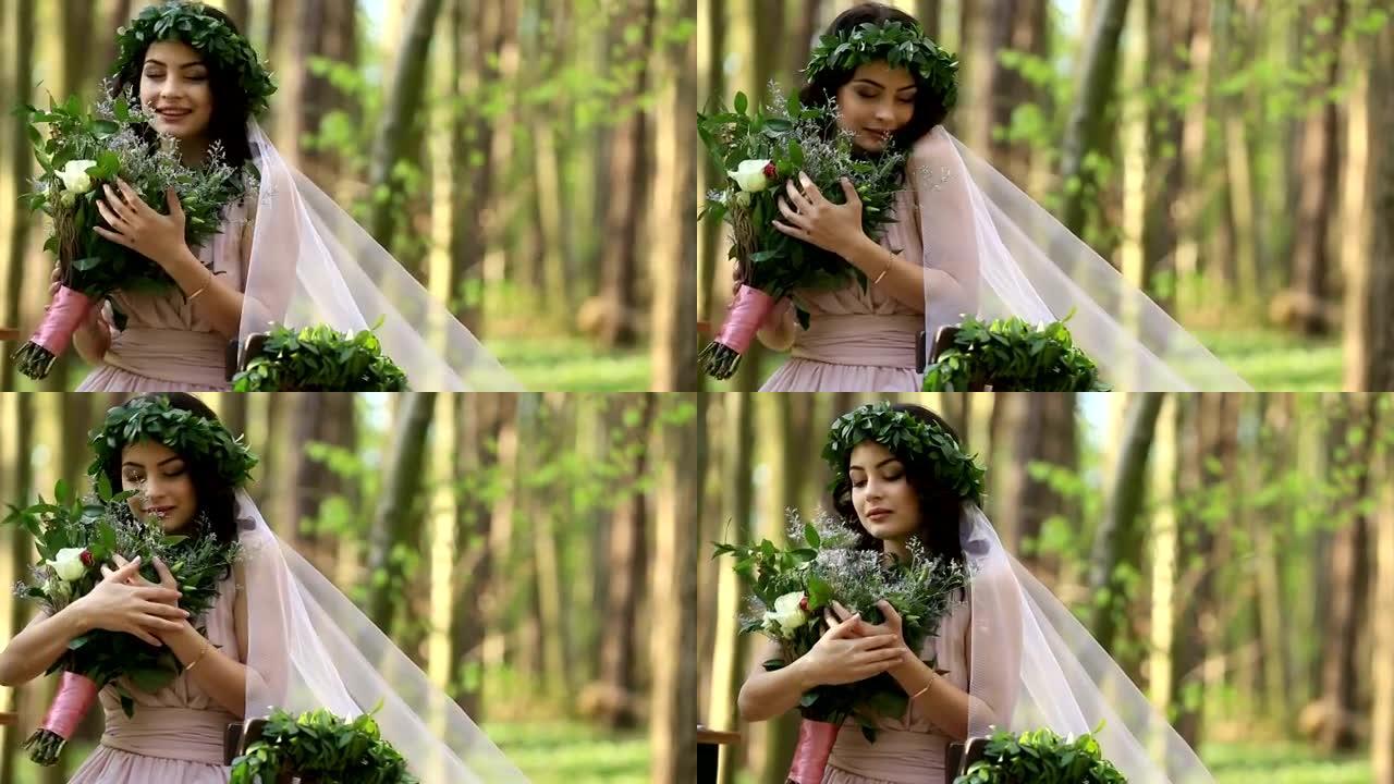 美丽的年轻黑发新娘，戴着月桂花环，森林里有大束白色春天的鲜花。幸福的时刻