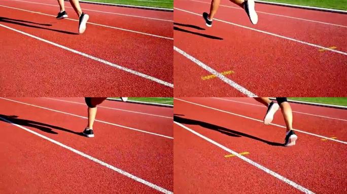 跟踪跑道运动员女子跑步的鞋子的摄像机