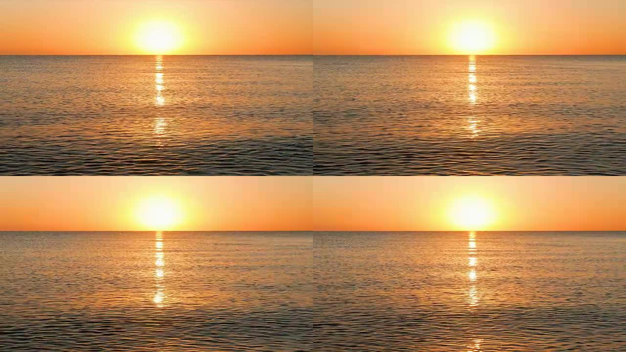 太阳升起在平静的海面上