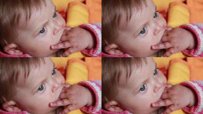 婴儿吮吸手指的特写镜头