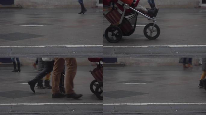 街上带婴儿车的无法识别的人的慢动作视频